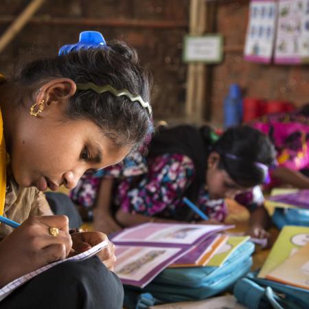Girls study at a school in Bangladesh.