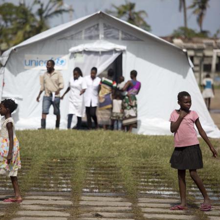 Girls in front of a tent