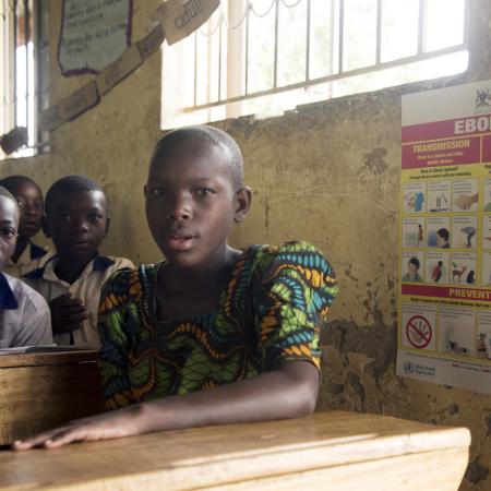 children sit in class