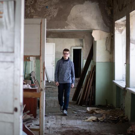 teen walking in a school