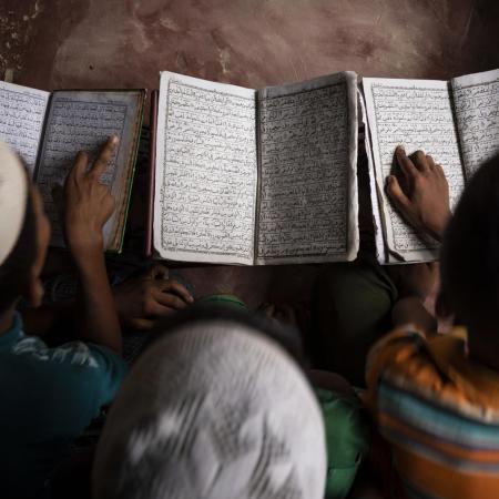 Boys study textbooks in a UNICEF learning centre.