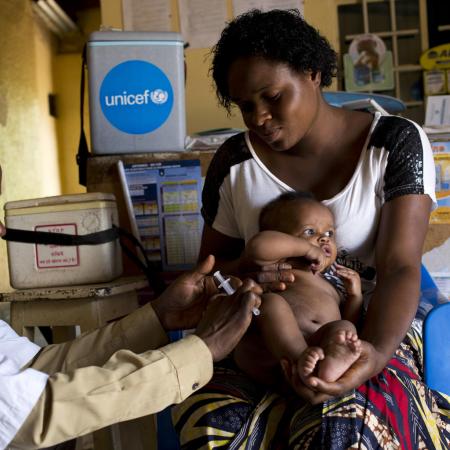 A young baby receives a measles vaccine.