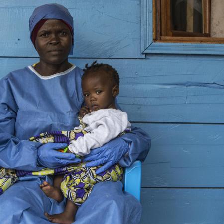 woman caring for children orphaned by Ebola