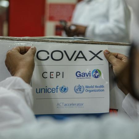 In India, on 23 February 2021, an employee packs and prepares for shipment a box containing COVID-19 vaccines for the COVAX facility at a manufacturer in Pune, a city located in the western Indian state of Maharashtra.