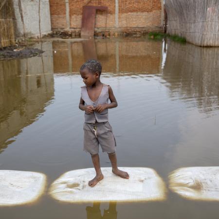 On 4 March 2021, a child plays in the floodwaters in Gatumba, located near Bujumbura in Burundi. At least 50,000 people have been affected by the floods in the region in the past year. A few kilometres from the floodwaters, a big IDP camp has been formed to shelter people displaced by the flooding. Burundi is extremely vulnerable to climate change and climate change -triggered natural disasters- and as one of the poorest countries in the world, it has very little means to protect its population.