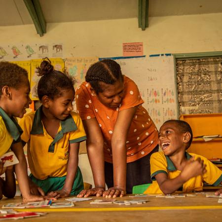 On 28th October, Janet, Special Needs Teacher, helps class 1 students in mainstream classroom during a group activity in Freswota, Port Vila, Vanuatu