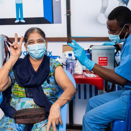 Shah SULTANA FARISHTA, 66,is being vaccinated against COVID-19 at the HJ Hospital.