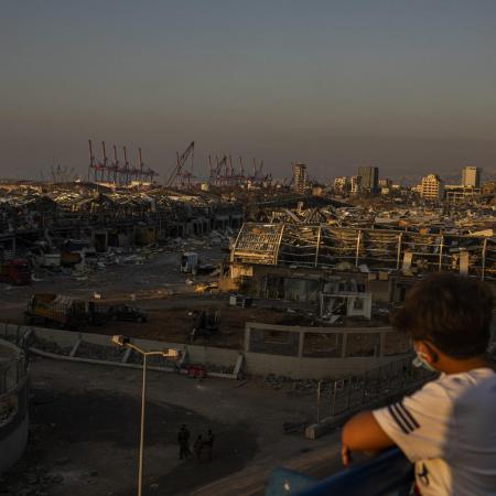 A young Lebanese looks over the area of the Beirut Port explosions on Thursday, August 6, 2020. The massive blast killed more than 20 people including six children; over 6,500 injured including an estimated 1,000 children.
