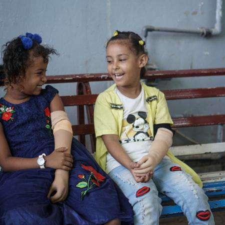 Malk, 7, and Abrar, 7, in the prosthetics centre in Aden, Yemen on 14 October 2021. Both children have a congenital disability and are receiving treatment in the centre