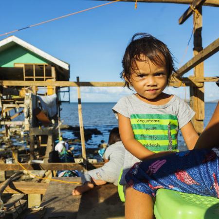 Gwendolyn Miano, 2, stands in the house her family has already started rebuilding December 20, 2021 in Barangay Fatima, Purok 1 in Ubay, Bohol, Philippines.