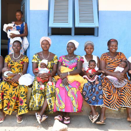 women in front of a clinic in Cote d'Ivoire