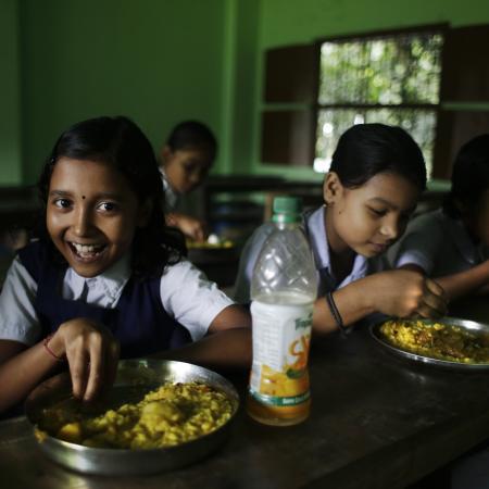 School children eat mid day meals at Mondalpara High School, Mondalpara Gaighata, West Bengal