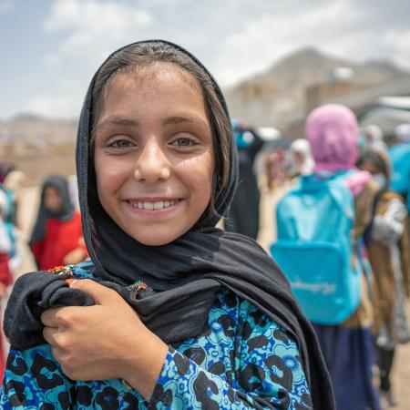 A young girl is photographed at a UNICEF-supported community-based education centre in Kabul Province, Afghanistan.