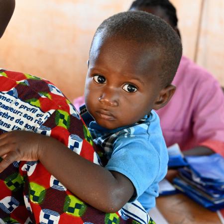 A mother with her baby at the CSPS Health Center, in Fada, in the east of Burkina Faso.