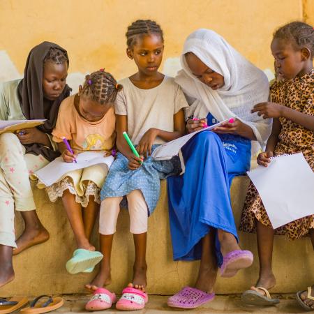 Displaced children engage in psychosocial activities at a gathering centre in Madani.