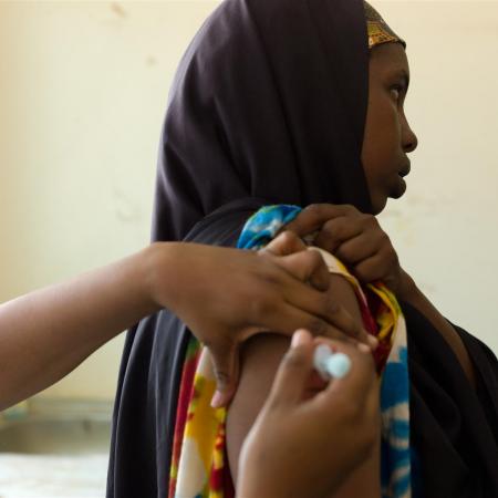 An expectant mother receives a tetanus vaccine.