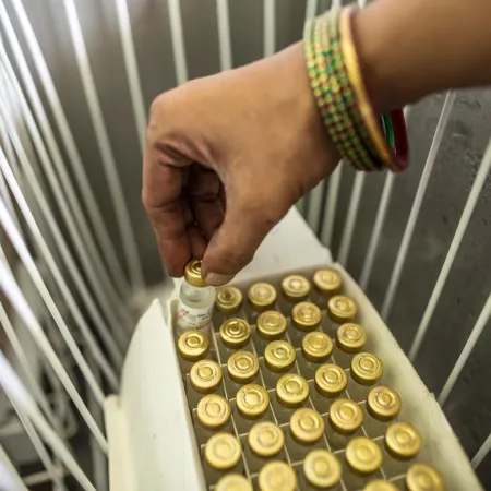 Pinky Kumari, Cold Chain Handler, prepares to keep vaccine in vaccine carriers at Primary health centre (PHE) in Begusarai, Bihar.