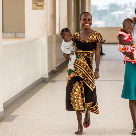 Women and babies walk in a clinic