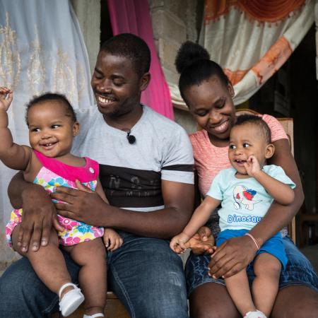 Guino Sylvain & Micherline Jean-Pierre, holding their twin children. Both assisted to a parenthood club to inform and prevent diseases coming from malnutrition. 