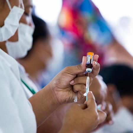 On 2 December 2019, Junior Registered Nurse, April Wilson, 22, (left) and team leader Luisa Popo, 50 prepare measles vaccines at a vaccination site in Leauvaa Village as part of the UNICEF-supported National Vaccination Campaign in response to the current measles outbreak in the Pacific region.