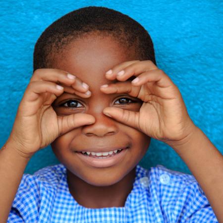 Happy child smiling in Gonzagueville, in Abidjan, Côte d'Ivoire.