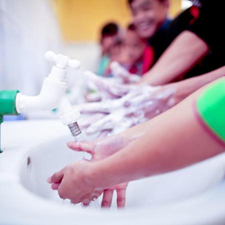 Children wash their hands at a primary school in Vietnam.