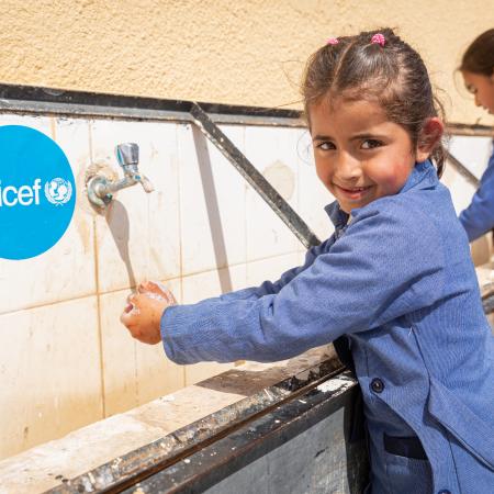 Children in Al Khader mixed primary school take part in a handwashing demonstration.  The students have been receiving and practicing hygiene promotion for three months. It can be difficult, the Principal explains, to find space in a tight school budget to spend on hygiene materials or infrastructure – even purchasing soap for the 67 students in this rural area can be a struggle.