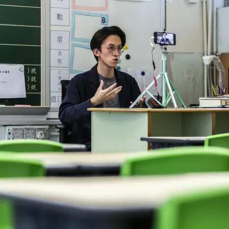 A primary school teacher records lessons for students in China.