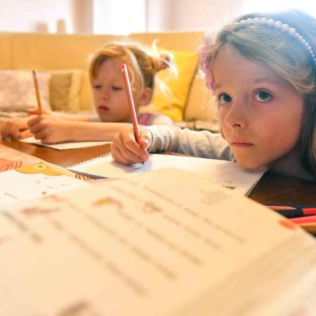 Skopje, 24 March 2020: Twins Ana (7) and Kaja (7) follow the TV-classroom programme with the same level of seriousness they usually do when at school.