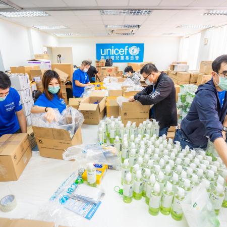 UNICEF workers sorting COVID-19 supplies