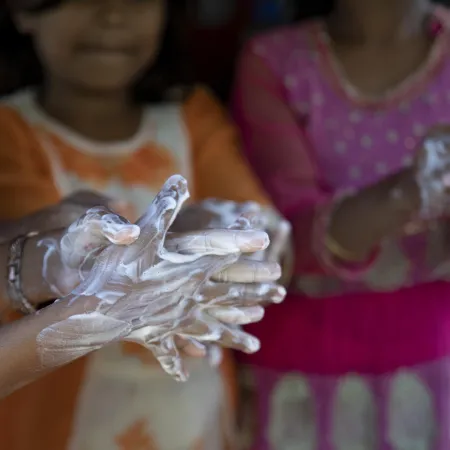 Rohingya children practice handwashing exercises.