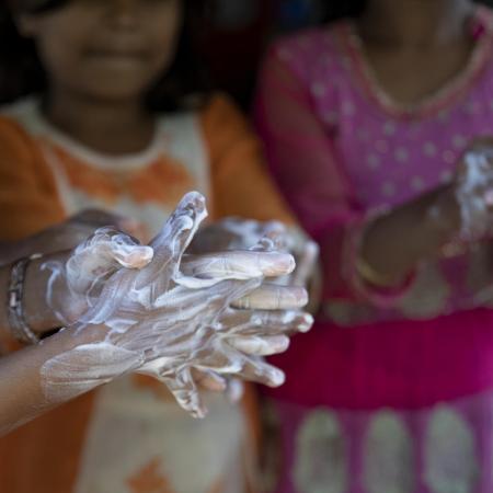 Rohingya children practice handwashing exercises.