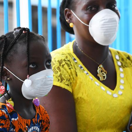 Mother and daughter wearing face masks