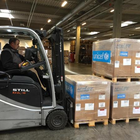 A UNICEF worker prepares to move supplies to be shipped to the DRC.