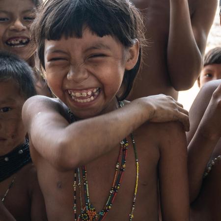 Children show off where they received vaccination shots.