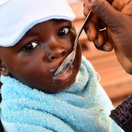 A mother feeding her baby at the Primature health center of San Pedro, in the South West of Côte d’Ivoire. 