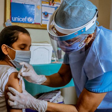 Paulina,10, is vaccinated in a health center located in Bolivar state where UNICEF distributed Polio, Yellow Fever, Tetanus Toxoid and BCG, on July 2, 2020.