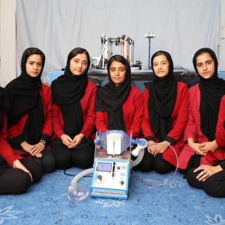 Members of the Afghan Dreamers team with their ventilator prototype.