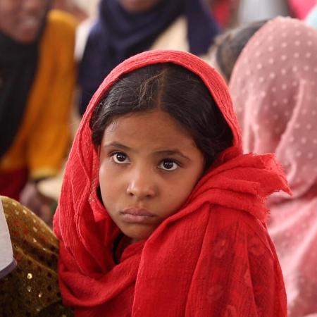 A portrait of a young girl at a Child Friendly Space (CFS) supported by UNICEF in Atbara.