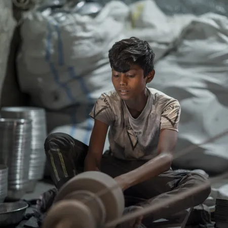 A child works in small silver polishing factory in Bangladesh