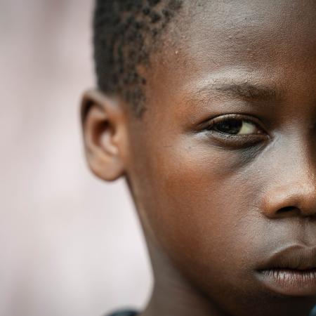 A child in Haiti looks towards the camera