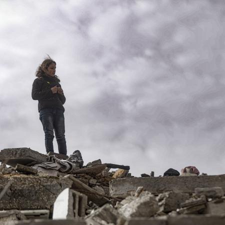 A Gazan child stands on top of rubble in Northern Gaza.