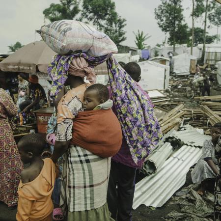Families who had been living in displaced persons camps around Goma seek shelter on their way to Shasha village in North Kivu province, DR Congo