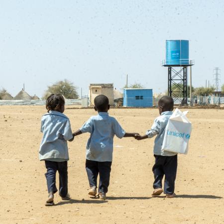 Children walk back home from a UNICEF-supported child friendly space in Al Houri internally displaced people’s (IDP) camp in Gedaref State.