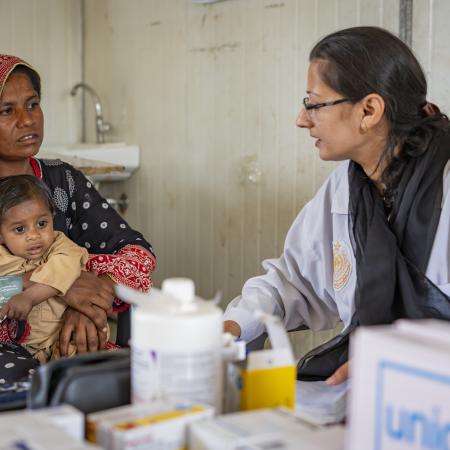 A mother with newborn getting doctor's assessment in Pakistan