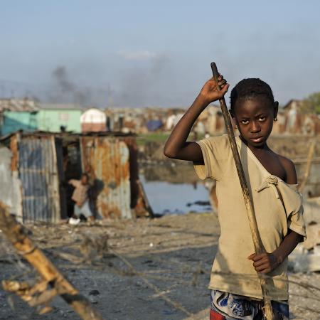 On 6 February, Luisnez, 10, sweeps away garbage and debris in front of her destroyed home, in Cité Soleil, one of the poorest neighbourhoods in Port-au-Prince, the capital. Together with three younger siblings and her mother, Luisnez is among many who sleep outdoors, or in makeshift tents, because their homes were damaged or destroyed during the earthquake or because they fear additional aftershocks “I don’t know what happened,” she said. “I was playing outside and everything started to fall."