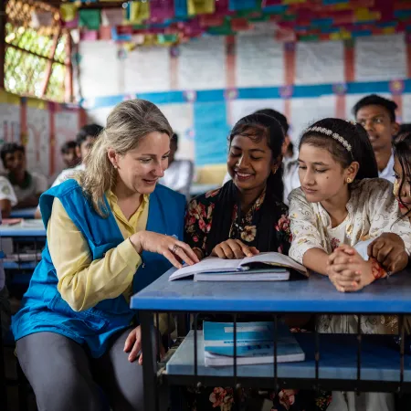 On 8 October 2025, at the Rohingya Refugee Camp in Cox’s Bazar, Bangladesh, UNICEF Private Fundraising and Partnerships Division Director, Carla Haddad Mardini, talks with young students during a visit to the Learning Centre..
