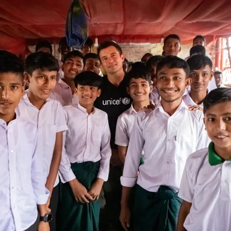 UNICEF Goodwill Ambassador Orlando Bloom pictured with Grade 9 children in Cox's Bazar who are at risk of losing access to education due to global funding cuts.