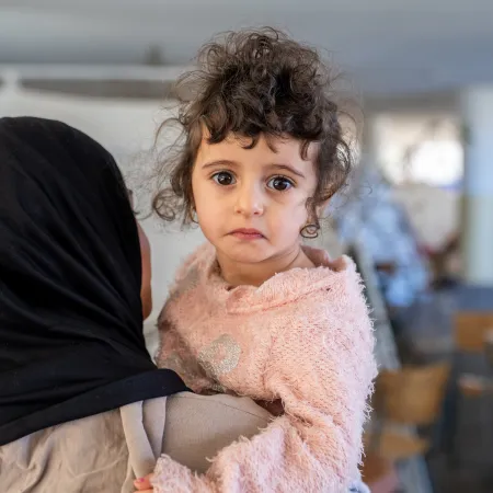 Mother holds her child in Lebanon