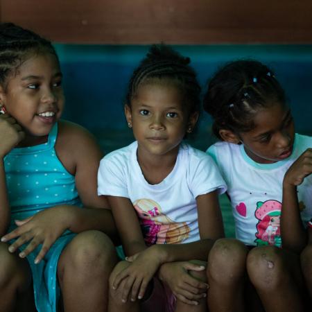 Children pose for the photo, in the rural town of El Peñon de Tapipa, in Miranda state, Venezuela.